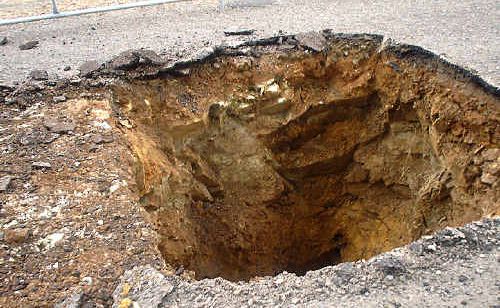 Lime Street was shut last week after workers peeled back bitumen to find this massive hole. Lime Street was shut last week after workers peeled back bitumen to find this massive hole.